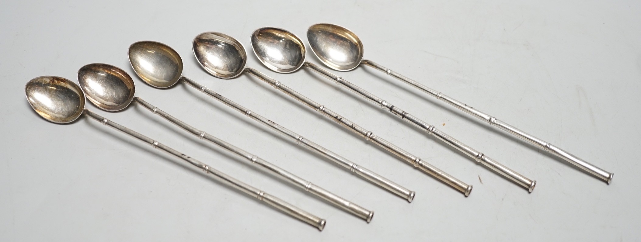 A set of six Chinese sterling cocktail straw spoons, 19.4 cm.